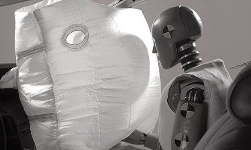 Crash test dummy with deployed airbag