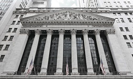 New York Stock Exchange building with American flags