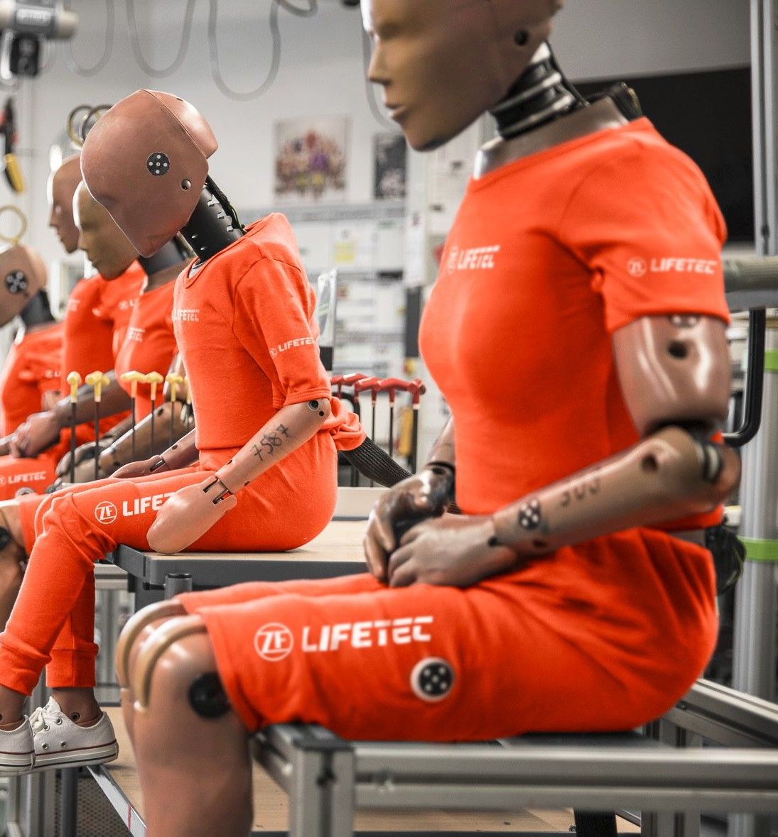 ZF Lifetec crash test dummies in orange suits