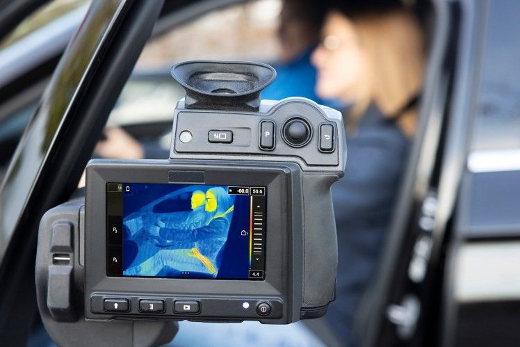 Thermal imaging camera mounted on vehicle dashboard