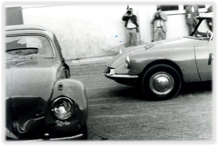 Vintage car crash with people nearby