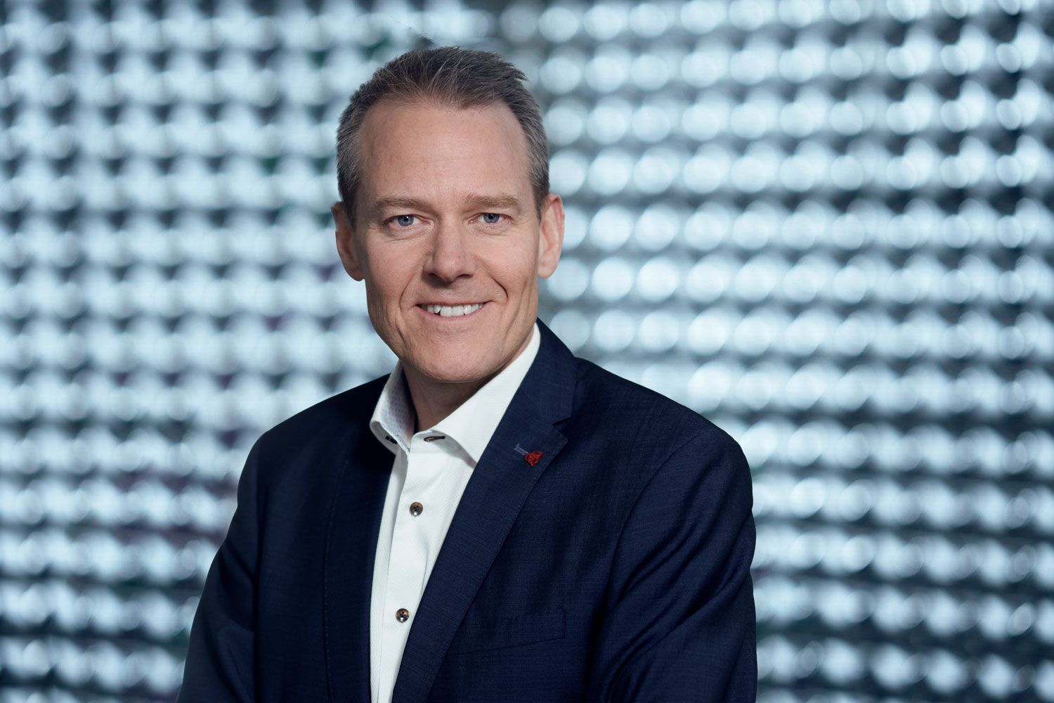 Man in suit smiling at camera