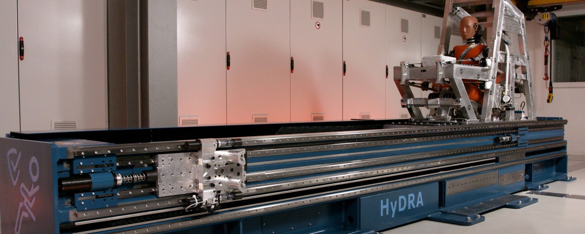 Hydraulic testing machine with crash test dummy