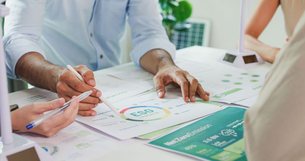 People reviewing documents with ZF Lifetec logo