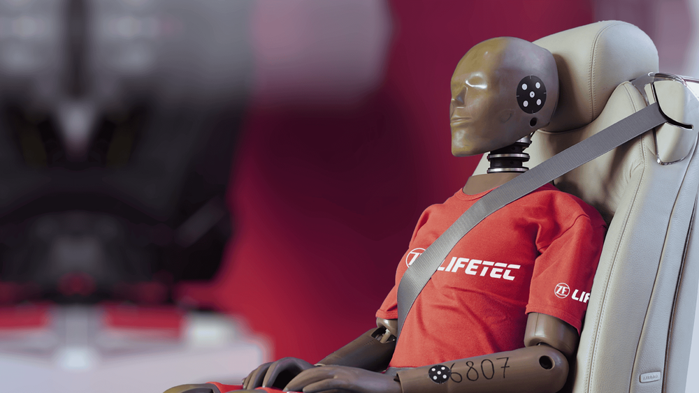 Crash test dummy wearing seatbelt, labeled LIFETEC