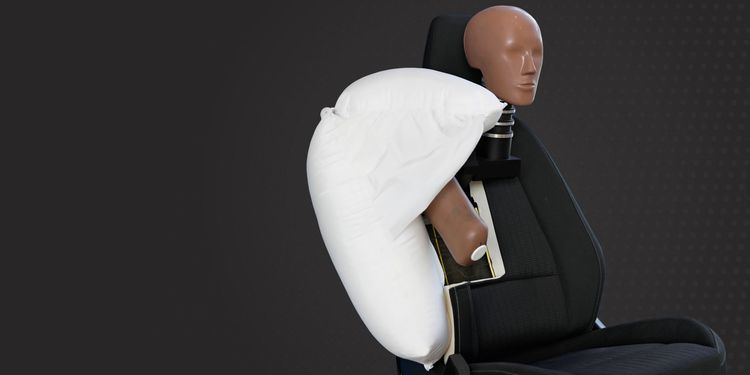 Crash test dummy with deployed side airbag