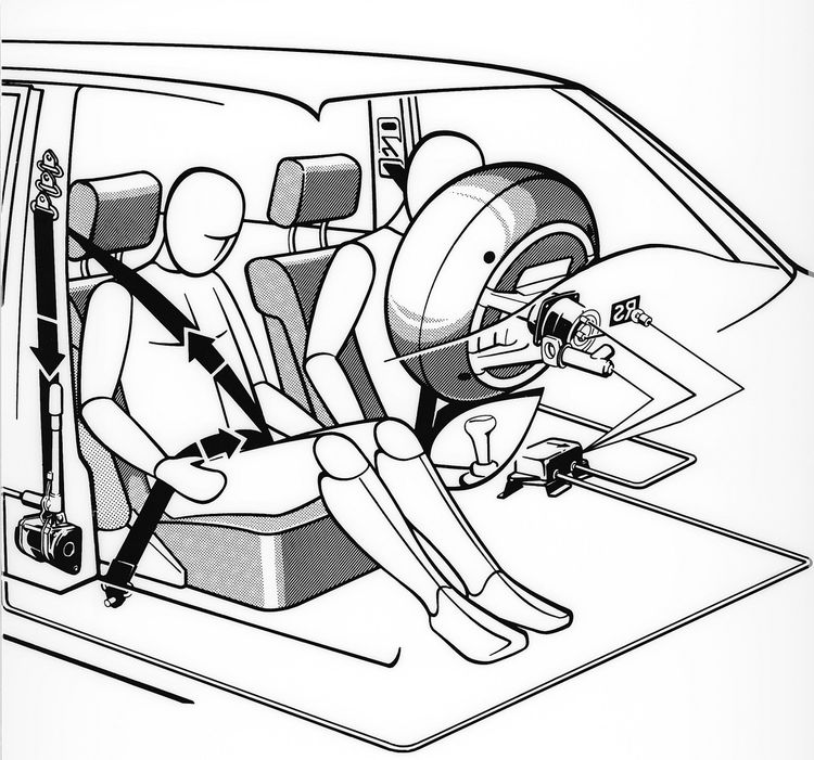 Driver and passenger in car with seat belts and airbags