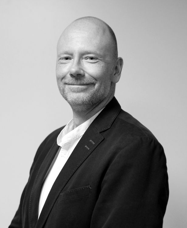 Man in suit smiling