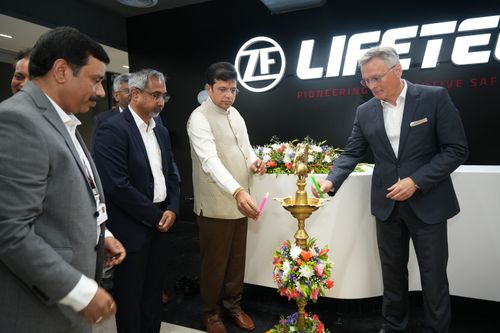 ZF Lifetec executives at launch event, lighting ceremonial lamp.