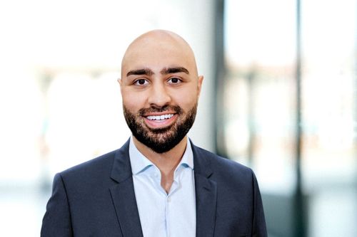 Man in suit smiling at camera