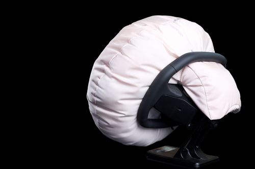Deployed airbag covering steering wheel